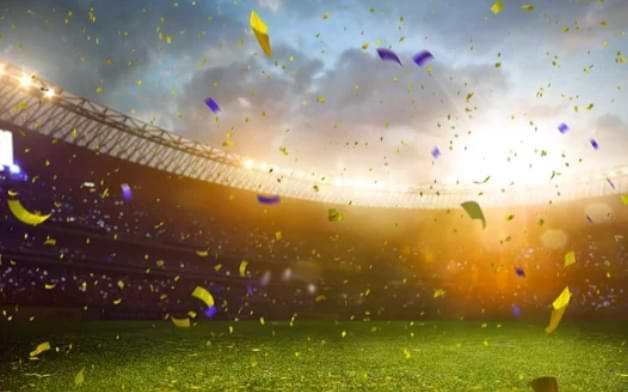 Fotbollsstadium med gul och bla konfetti - vilket lag hejar svenskarna pa