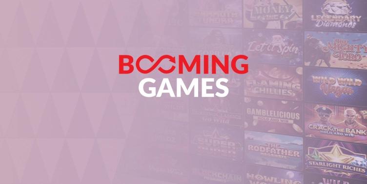 lila bakgrund med olika spel text Booming Games - Manadens speltillverkare Maria Casino
